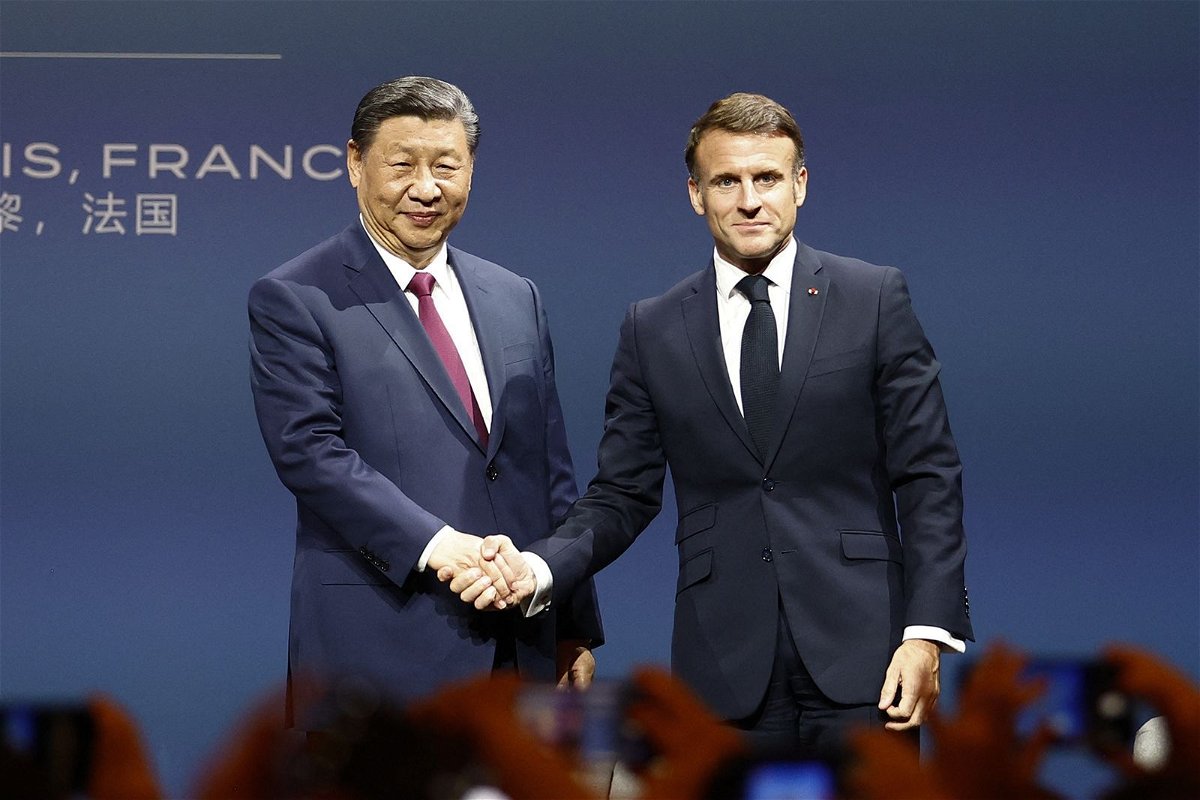 French President Emmanuel Macron and Chinese leader Xi Jinping shake hands after a meeting of the Franco-Chinese Business Council in Paris on May 6.