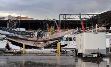 Debris is seen at a damaged FedEx facility after a tornado in Portage