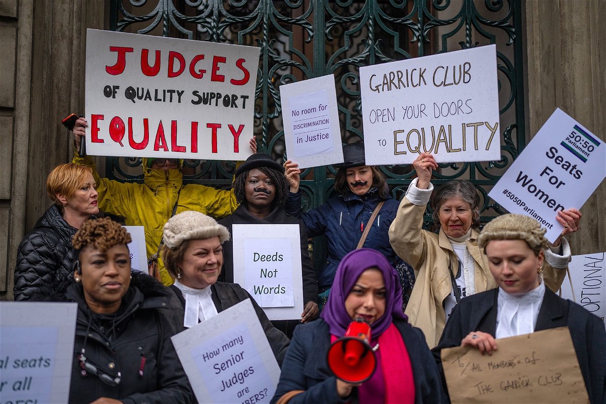 <i>Carl Court/Getty Images via CNN Newsource</i><br/>Protesters are pictured outside the Garrick Club on March 28.