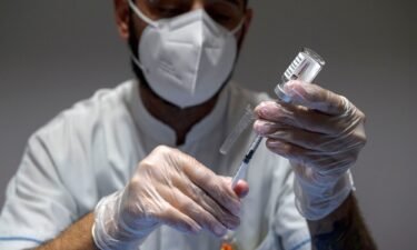 A healthcare worker prepares doses of the AstraZeneca Covid-19 vaccine at a vaccine hub in the Auditorium della Tecnica in Rome in June 2021. AstraZeneca is withdrawing its highly successful coronavirus vaccine.