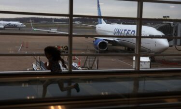 A young passenger runs through a hallway at Ronald Reagan Washington National Airport in Arlington