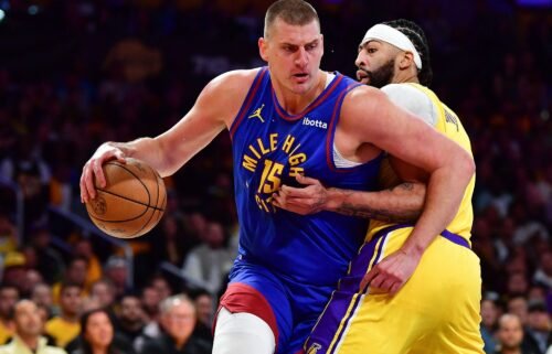 Denver Nuggets center Nikola Jokic moves the ball against Los Angeles Lakers forward Anthony Davis.