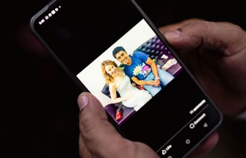 Jameel Shah shows a photo of himself with Australian actor and singer Kylie Minogue in Mumbai on April 14.