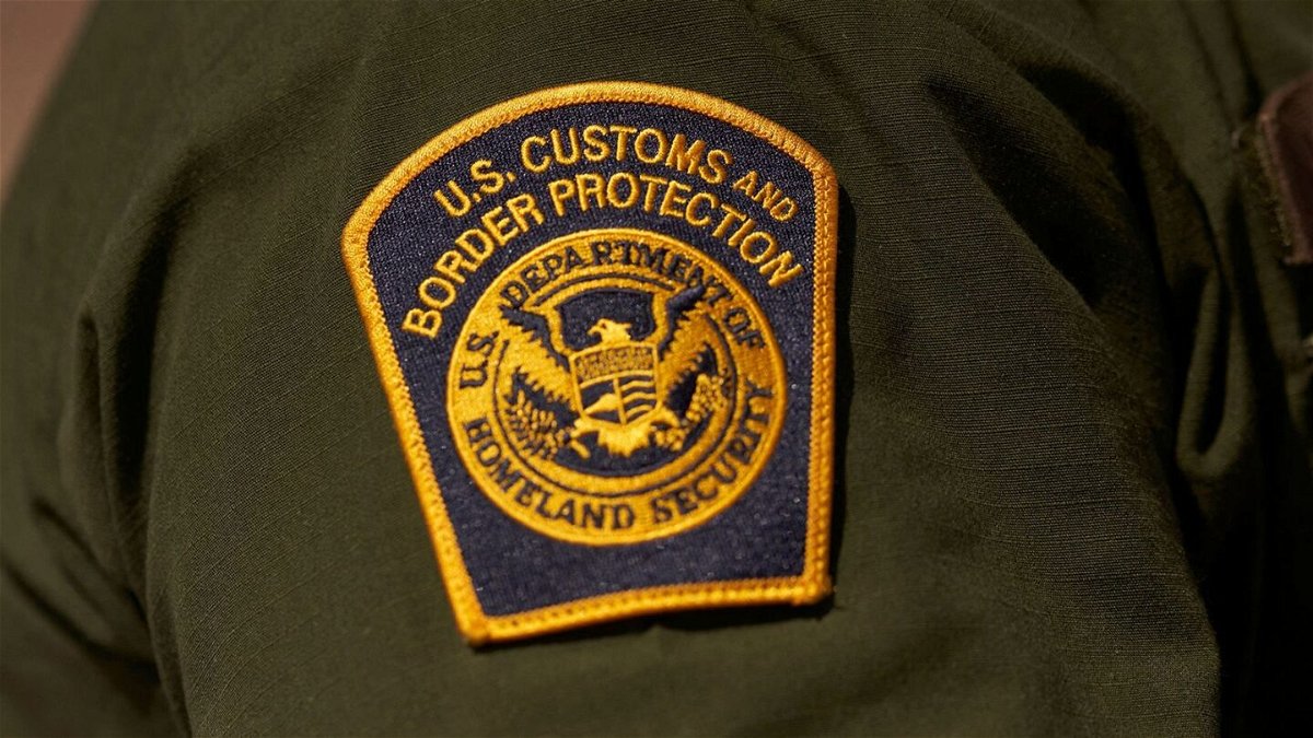 <i>ALLISON DINNER/AFP/AFP via Getty Images via CNN Newsource</i><br/>A US Customs and Border Protection patch on the arm of an agent in the Jacumba mountains on October 6