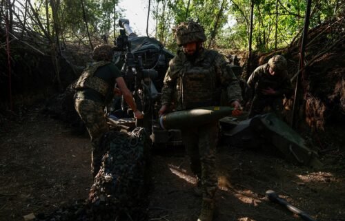 Ukrainian servicemen fire a M777 howitzer toward Russian troops near a front line in the Donetsk region