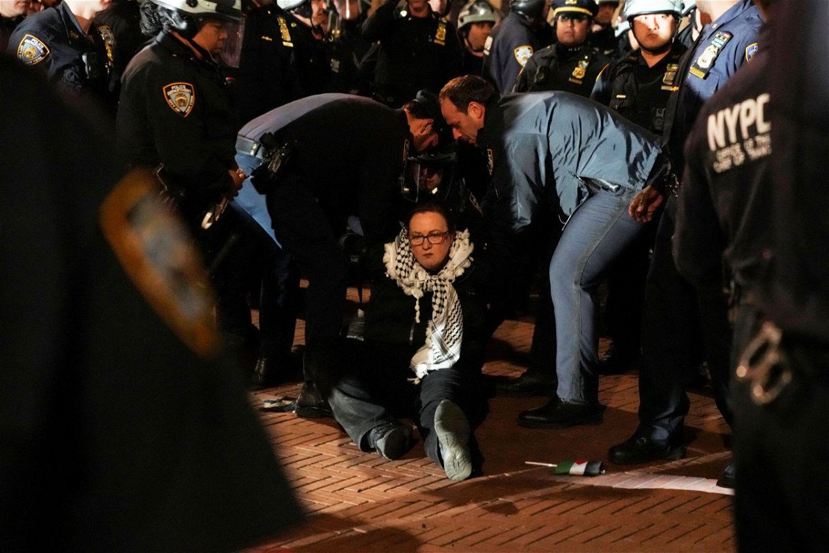 Police detain a protestor