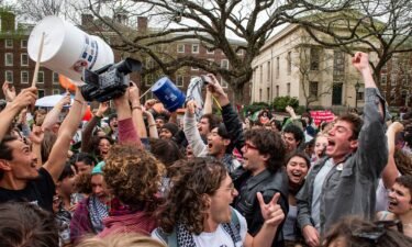 Pro-Palestinian students celebrate reaching a deal with the administration at Brown University