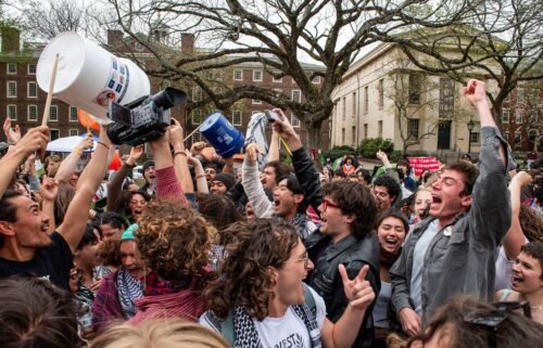 Pro-Palestinian students celebrate reaching a deal with the administration at Brown University