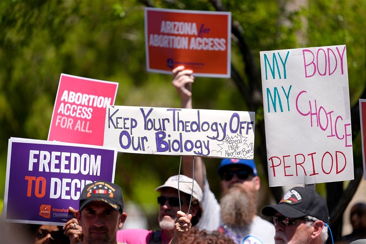 <i>Matt York/AP/File via CNN Newsource</i><br/>Arizona Democratic governor signs bill repealing 1864 abortion ban. Abortion rights supporters gather outside the Capitol in Phoenix on April 17