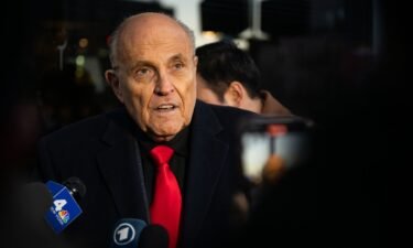 Rudy Giuliani speaks to members of the media where Republican candidate Florida Gov. Ron DeSantis was scheduled to host a campaign event on January 21