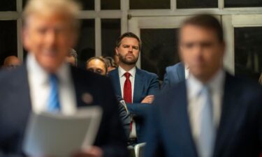 Sen. JD Vance looks on as former President Donald Trump speaks to the media during his criminal hush money trial at the Manhattan Criminal Court on May 13 in New York City.