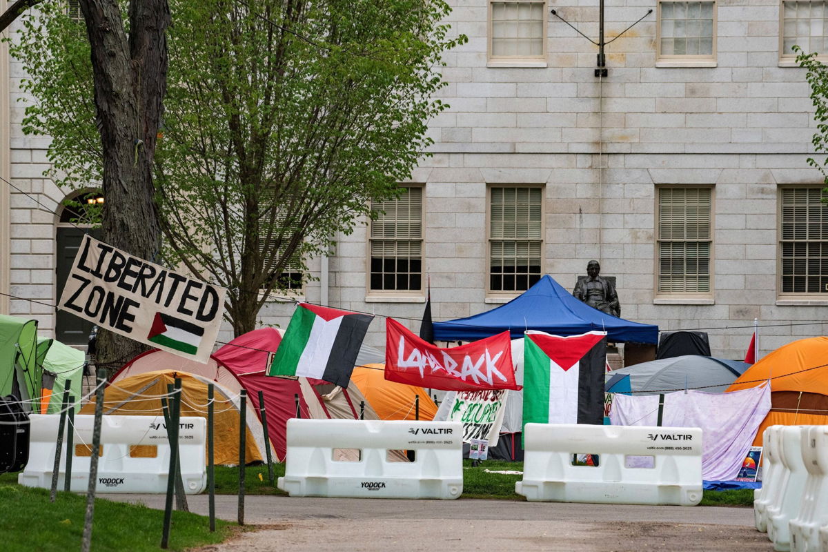 <i>Joseph Prezioso/AFP via Getty Images via CNN Newsource</i><br/>Tents and signs are seen here at the Pro-Palestinian encampment at Harvard Yard at Harvard University in Cambridge