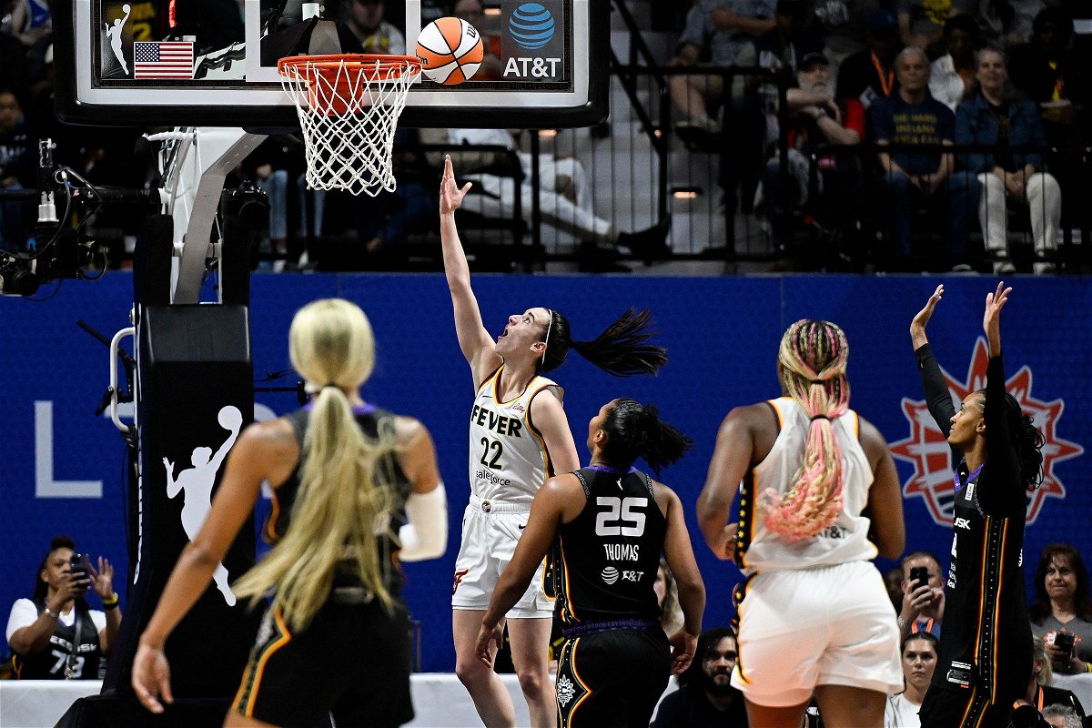 <i>Jessica Hill/AP via CNN Newsource</i><br/>Indiana Fever guard Caitlin Clark scores her first WNBA regular season basket against during a game against the Connecticut Sun in Uncasville
