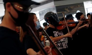 A group of musicians play 'Glory to Hong Kong