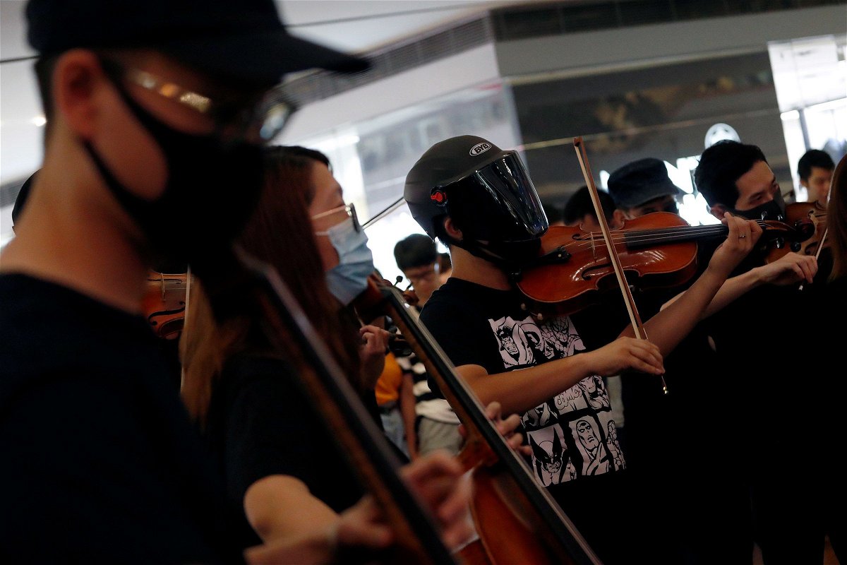 <i>Tyrone Siu/Reuters/File via CNN Newsource</i><br/>A group of musicians play 'Glory to Hong Kong