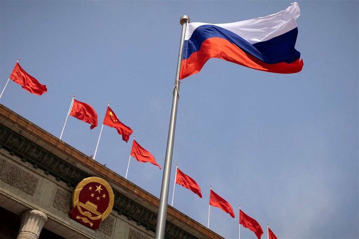 <i>Thomas Peter/Pool/Reuters via CNN Newsource</i><br/>The Russian flag flies in front of the Great Hall of the People before a welcoming ceremony for Russian Prime Minister Mikhail Mishustin in Beijing last May.