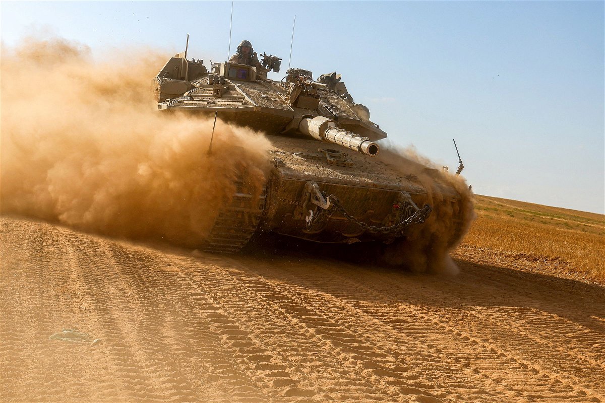 <i>Jack Guez/AFP/Getty Images via CNN Newsource</i><br/>An Israeli army battle tank moves near the border with the Gaza Strip at a location in southern Israel on May 13