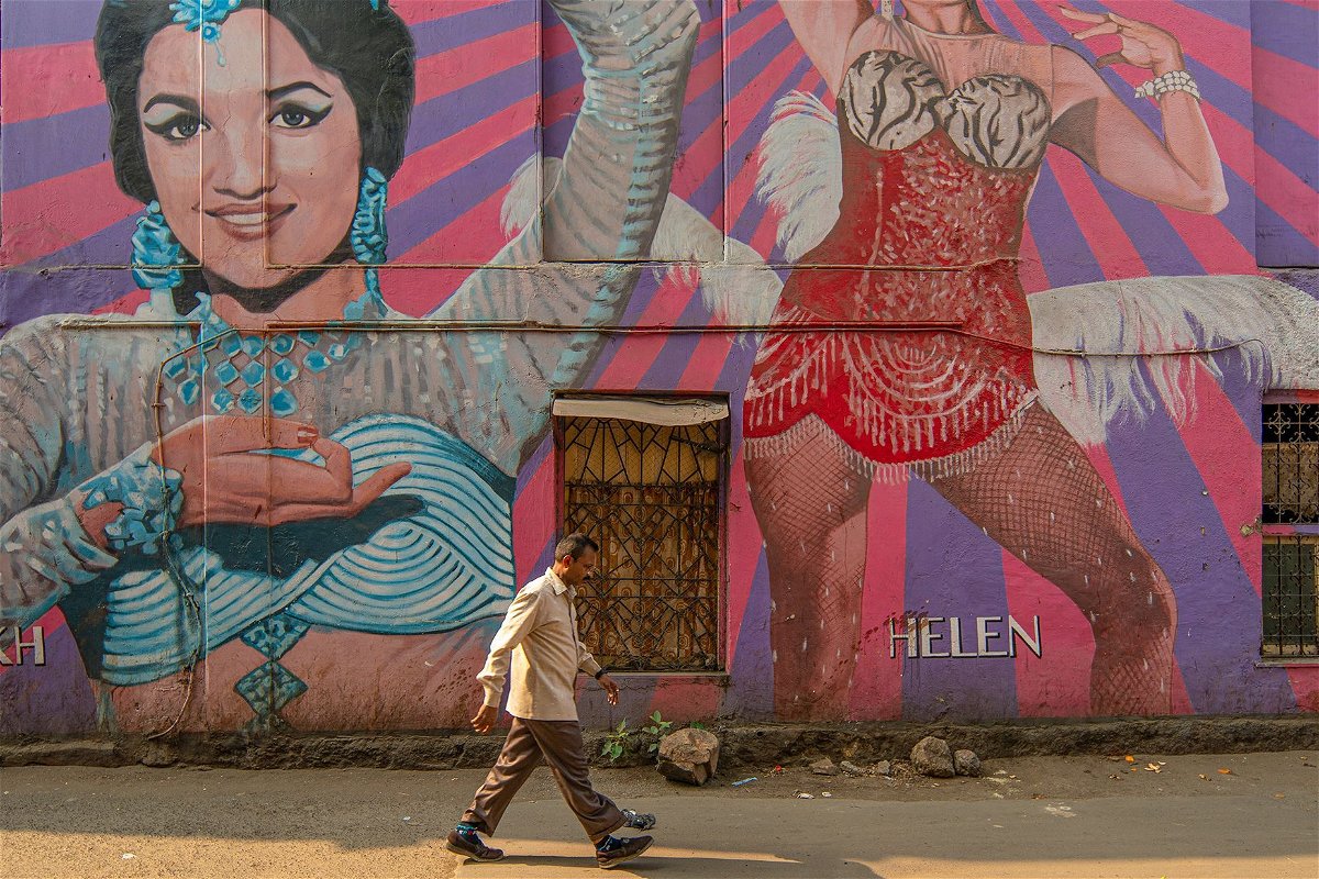 <i>Noemi Cassanelli/CNN via CNN Newsource</i><br/>A man walks past a mural portraying Bollywood Indian actresses Asha Parekh and Helen