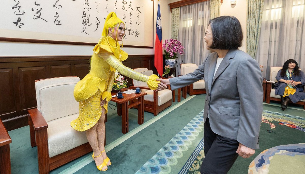 <i>Wang Yu Ching/Office of the President via CNN Newsource</i><br/>Taiwanese drag queen Nymphia Wind shakes hands with Taiwan's outgoing leader Tsai Ing-wen.