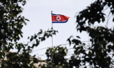 The North Korean flag flies above the North Korean embassy in Beijing in September 2016. US federal prosecutors on May 16 charged an Arizona woman in a North Korean IT worker scheme that raised millions.