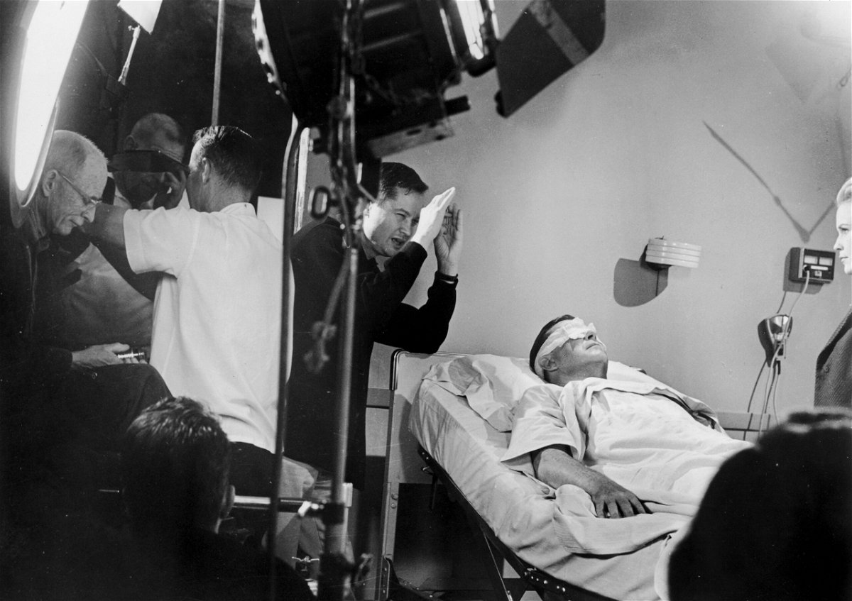 <i>Hulton Archive/Getty Images via CNN Newsource</i><br/>Roger Corman (center) and actor Ray Milland (left) on the set of 'X: The Man with the X-Ray Eyes' in 1963.