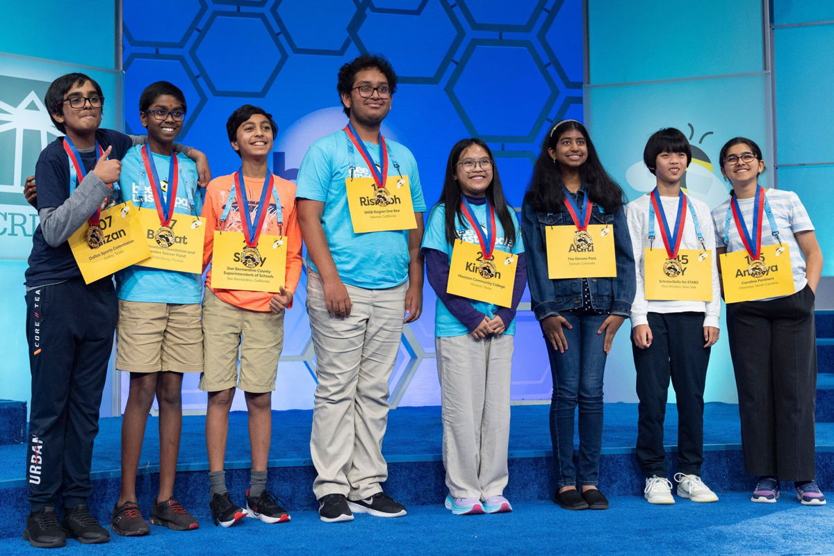 <i>Jacquelyn Martin/AP via CNN Newsource</i><br/>The final eight competitors of the Scripps National Spelling Bee pose for a group photograph after the conclusion of the semifinals