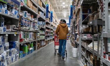 People shop at a home improvement store in Brooklyn on January 25 in New York City. It’s becoming tougher and tougher for Americans to carry on with their spending spree.
