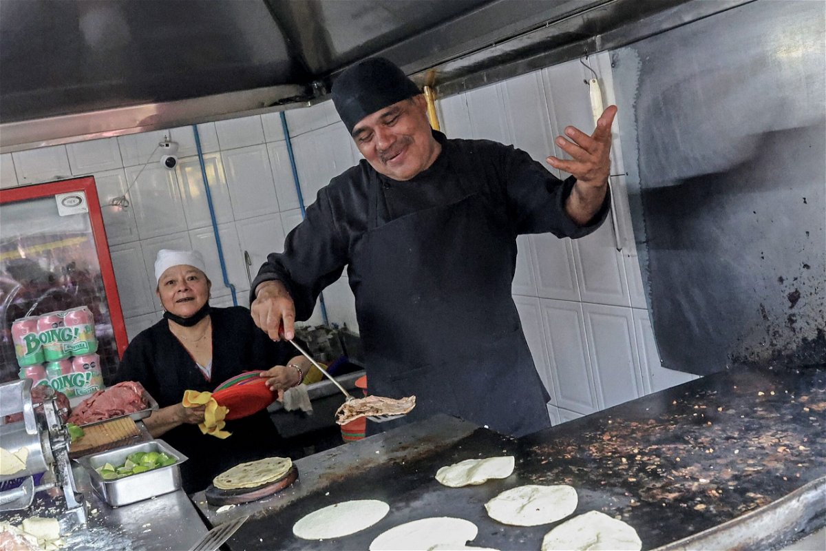 <i>Silvana Flores/AFP/Getty Images via CNN Newsource</i><br/>Chef Arturo Rivera Martinez prepares tacos at Taquería El Califa de León restaurant in Mexico City on May 15.