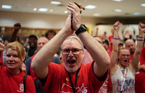People react as the result of a vote comes in favour of the hourly factory workers at Volkswagen's assembly plant to join the United Auto Workers (UAW) union