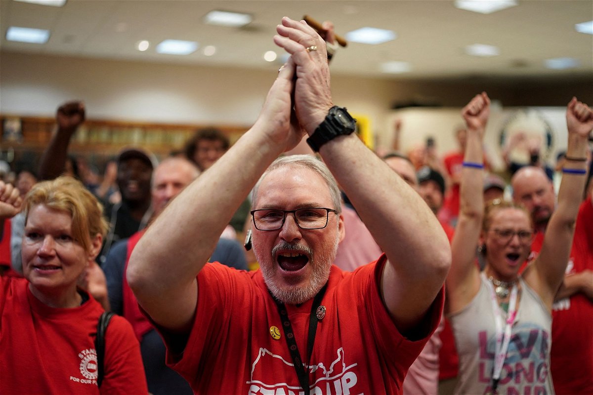 <i>Seth Herald/Reuters via CNN Newsource</i><br/>People react as the result of a vote comes in favour of the hourly factory workers at Volkswagen's assembly plant to join the United Auto Workers (UAW) union