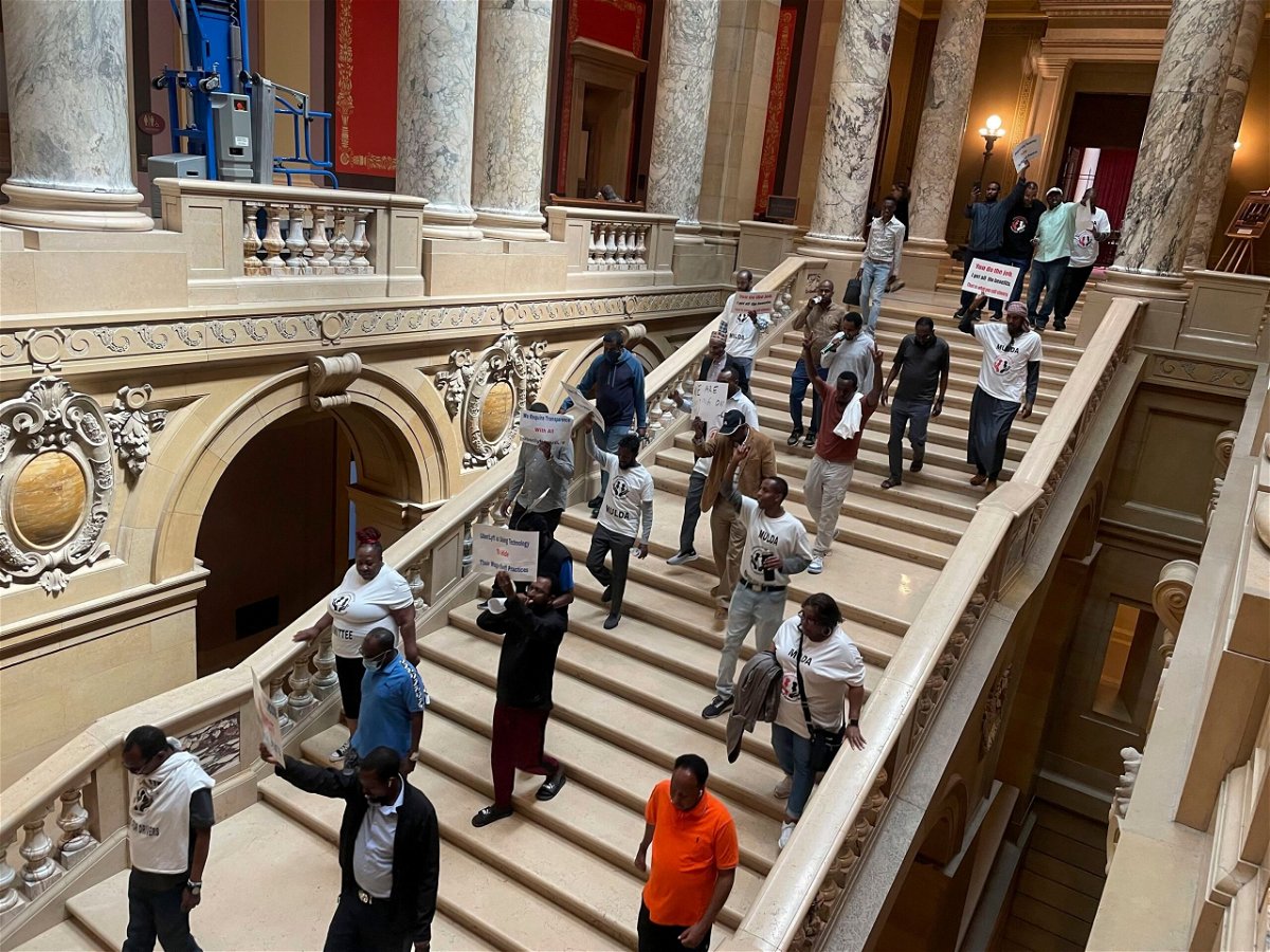 <i>Trisha Ahmed/AP via CNN Newsource</i><br/>Protesters descend a staircase in the Minnesota State Capitol building in St. Paul