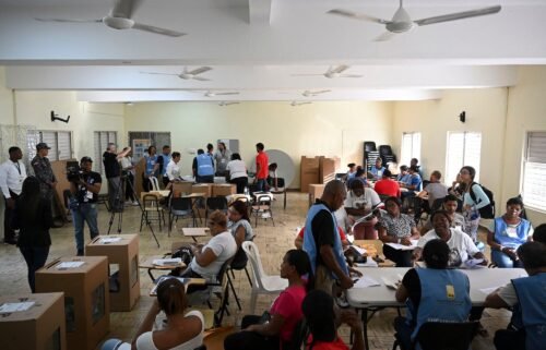 Electoral employees count votes during the general elections in Santo Domingo on May 19.