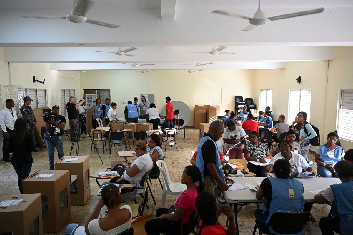 <i>Federico Parra/AFP/Getty Images via CNN Newsource</i><br/>Electoral employees count votes during the general elections in Santo Domingo on May 19.