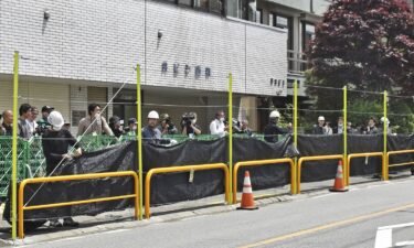 Workers started erecting the eight feet tall black screen on May 21.