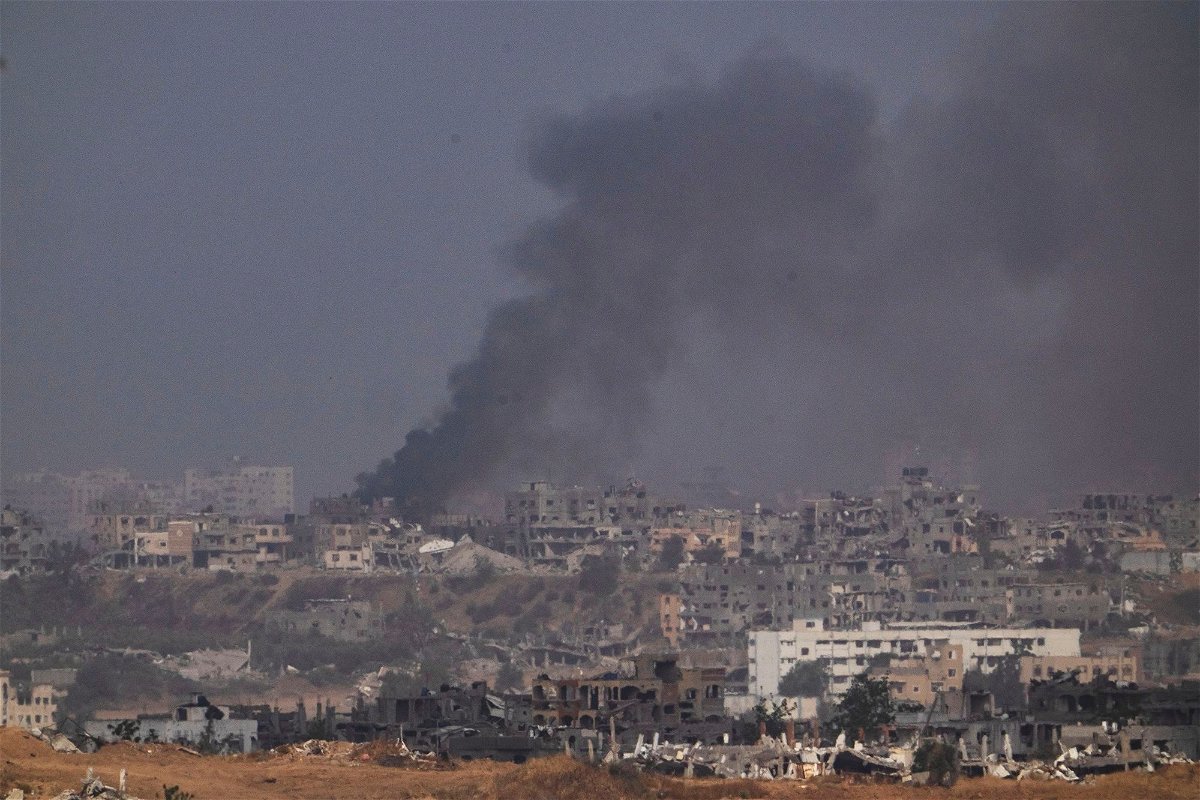<i>Leo Correa/AP via CNN Newsource</i><br/>Smoke rises to the sky after explosion in the Gaza Strip