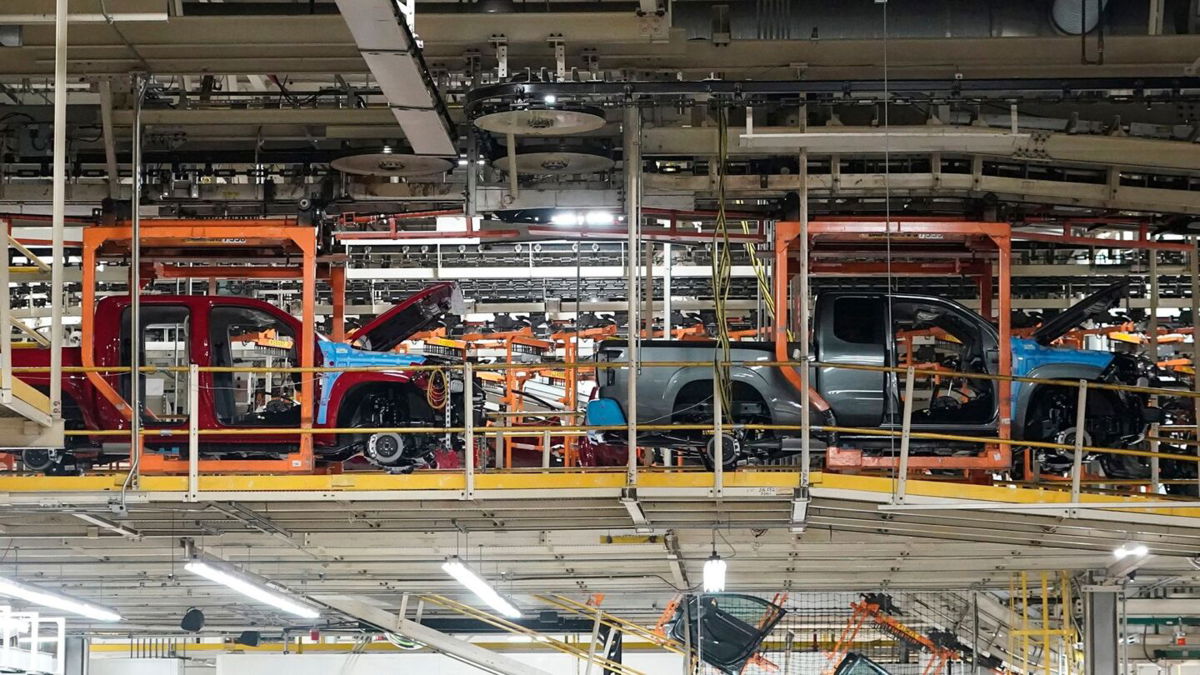 <i>Rogelio V. Solis/AP via CNN Newsource</i><br/>Trucks are lined up on the assembly line at Nissan's Canton Vehicle Assembly Plant