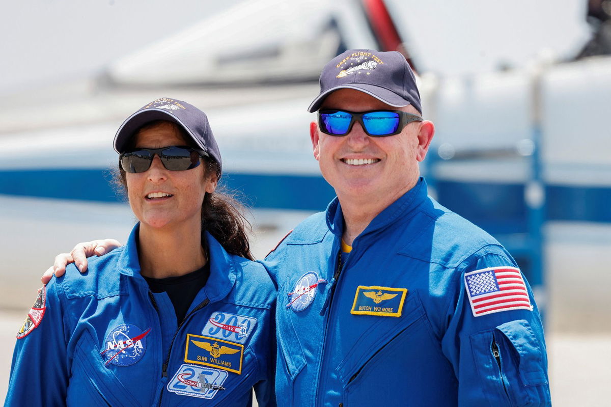 <i>Joe Skipper/Reuters via CNN Newsource</i><br/>NASA astronauts Suni Williams (left) and Butch Wilmore pose on April 25 ahead of the planned Starliner launch attempt.