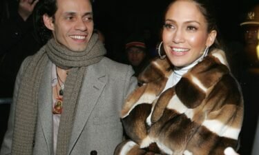 Jennifer Lopez stands with Marc Anthony in 2005.