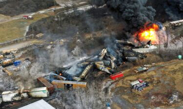 Charred and burning debris from a Norfolk Southern freight train lie scattered on February 4