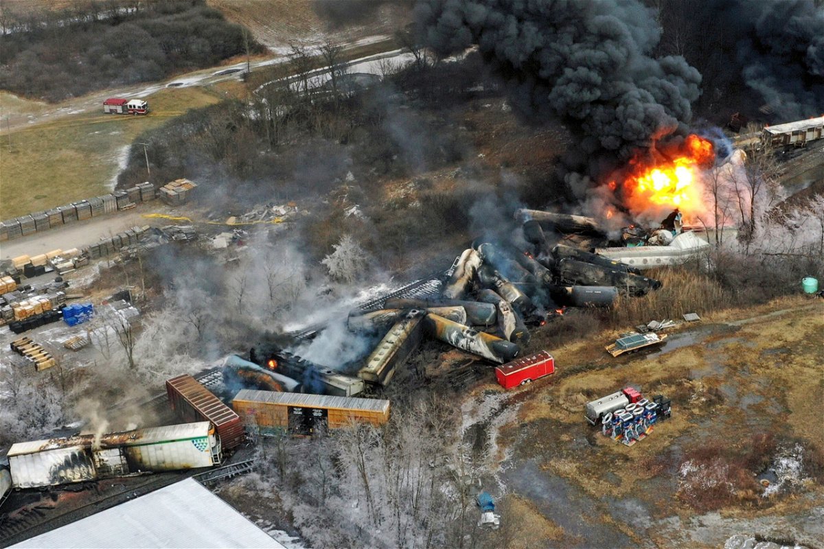 <i>Gene J. Puskar/AP via CNN Newsource</i><br/>Charred and burning debris from a Norfolk Southern freight train lie scattered on February 4