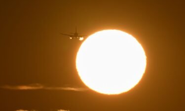 A plane arrives at San Francisco International Airport during sunset on May 15. Much of the country is forecast to have higher-than-average temperatures this summer. That could affect flights depending on how hot it gets.