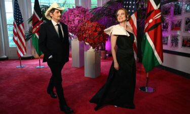 Country star Brad Paisley and his wife actress Kimberly Williams-Paisley arrive at the Booksellers Room of the White House on the occasion of the State Dinner with the Kenyan president at the White House in Washington