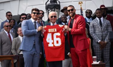 Kansas City Chiefs tight end Travis Kelce and quarterback Patrick Mahomes present President Joe Biden with a jersey during a celebration for the Kansas City Chiefs last year.