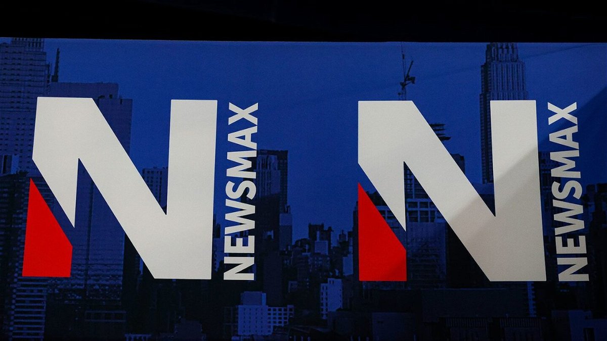 <i>Aaron M. Sprecher/AP/File via CNN Newsource</i><br/>A detail view of the Newsmax logo during the National Rifle Association Annual Meeting