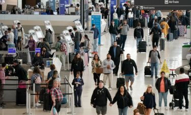 Passengers check in at San Francisco International Airport on May 24