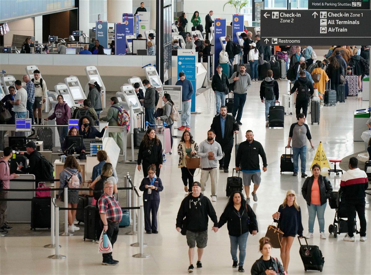 <i>Liu Guanguan/China News Service/VCG/Getty Images via CNN Newsource</i><br/>Passengers check in at San Francisco International Airport on May 24
