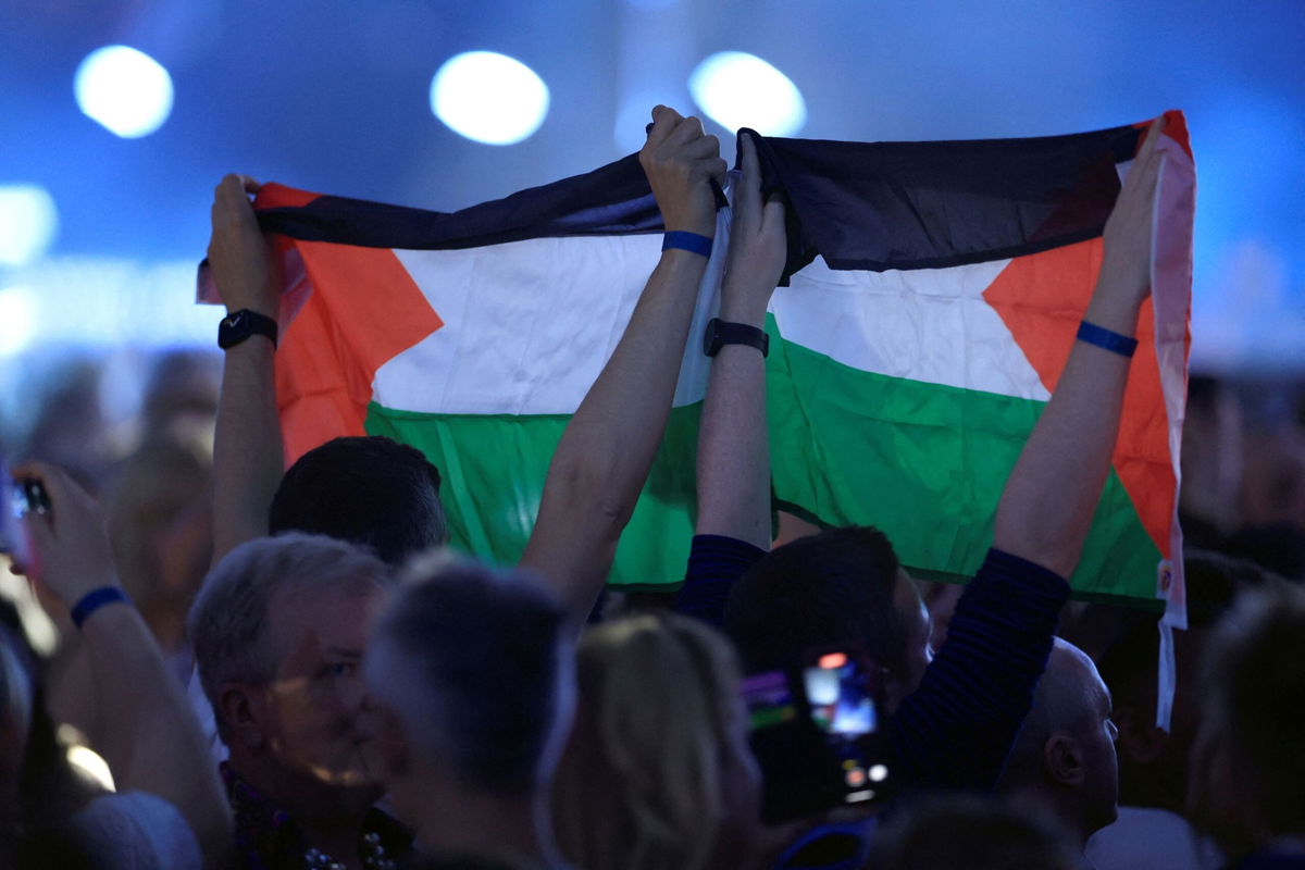 <i>Andreas Hillergren/TT News Agency/Reuters via CNN Newsource</i><br/>Audience members hold Palestinian flags in the crowd during the final dress rehearsal before the 68th edition Eurovision Song Contest final at Malmo Arena