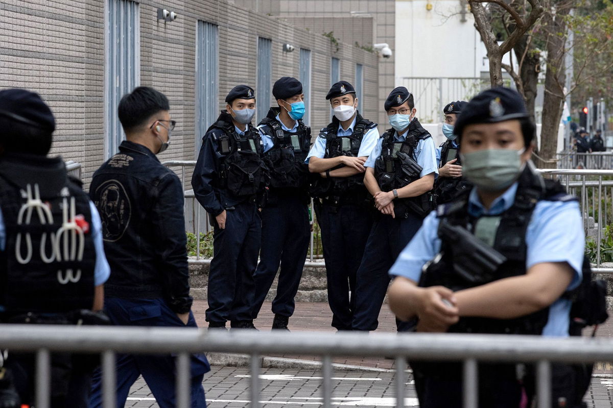 <i>Tyrone Siu/Reuters via CNN Newsource</i><br/>Police stand guard outside the West Kowloon Magistrates' Courts during the hearing of Hong Kong's 47 pro-democracy activists on February 6
