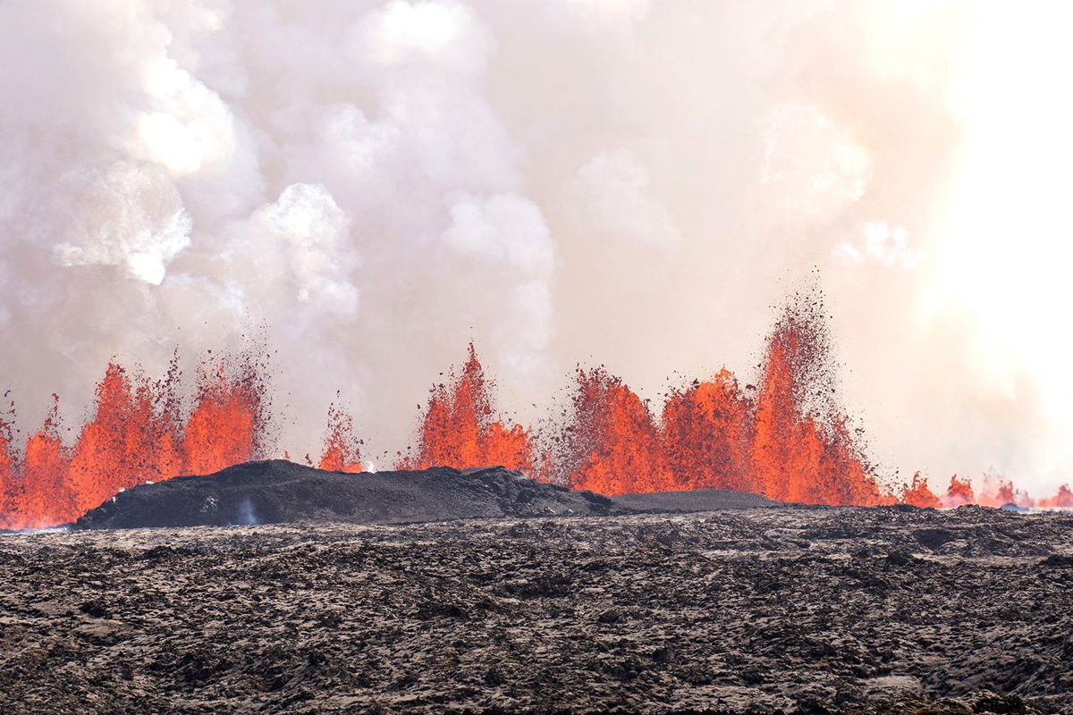 <i>Marco di Marco/AP via CNN Newsource</i><br/>A volcano spews lava in Grindavík
