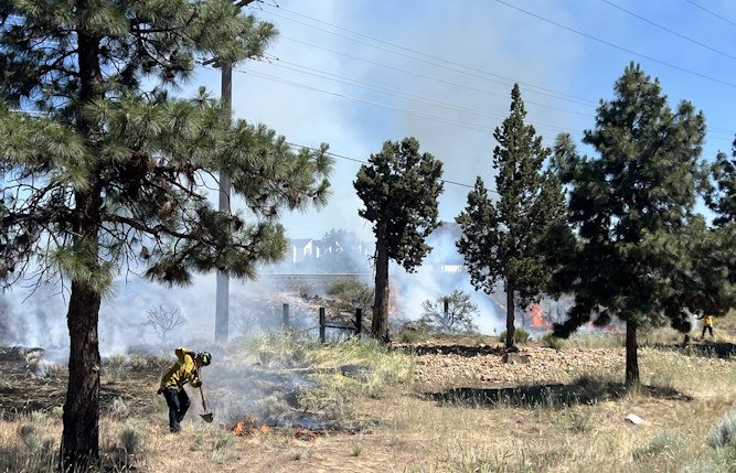 Brush fire by Bend Parkway railroad tracks 6-24